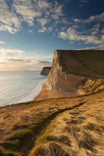 The cliffs of Swyre Head and Bat&#039;s Head in the light of the falling sun, on the Jurassic coast, Dorset, England