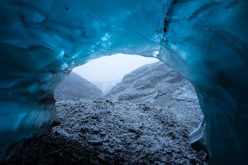Wednesday 25th November 2015, Vatnajökull national park, Iceland: Photographer Mikael Buck with assistance from renowned local Icelandic guide Einar Runar Sigurdsson, explored the frozen world of Vatnajökull glacier in Iceland using Sonys world first back-illuminated full-frame sensor  which features in the ?7R II camera. His images were taken without use of a tripod or any image stitching techniques in photoshop. This was made possible through Sonys new sensor technology, allowing incredibly detailed low-light hand held photography. Previously images this detailed would have required carrying bulky equipment to the caves, some of which can require hiking and climbing over a glacier for up to two hours to to access. This picture: Inside the &#039;ABC cave&#039; - which stands for Amazing Blue Cave. This view shows a snow storm outside the entrance to the cave. PR Handout - editorial usage only. Photographer&#039;s details not to be removed from metadata or byline. For further information please contact Rochelle Collison at Hope & Glory PR on 020 7014 5306 or rochelle.collison@hopeandglorypr.com Copyright: © Mikael Buck / Sony 07828 201 042 / mikaelbuck@gmail.com